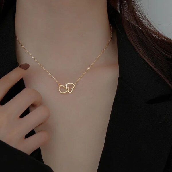 CADENA CORAZONES ENTRELAZADOS ACERO 316L CON BAÑO DE 18K